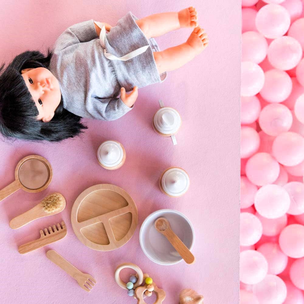 Collage of a doll and wooden doll accessories kit from Make ME Iconic