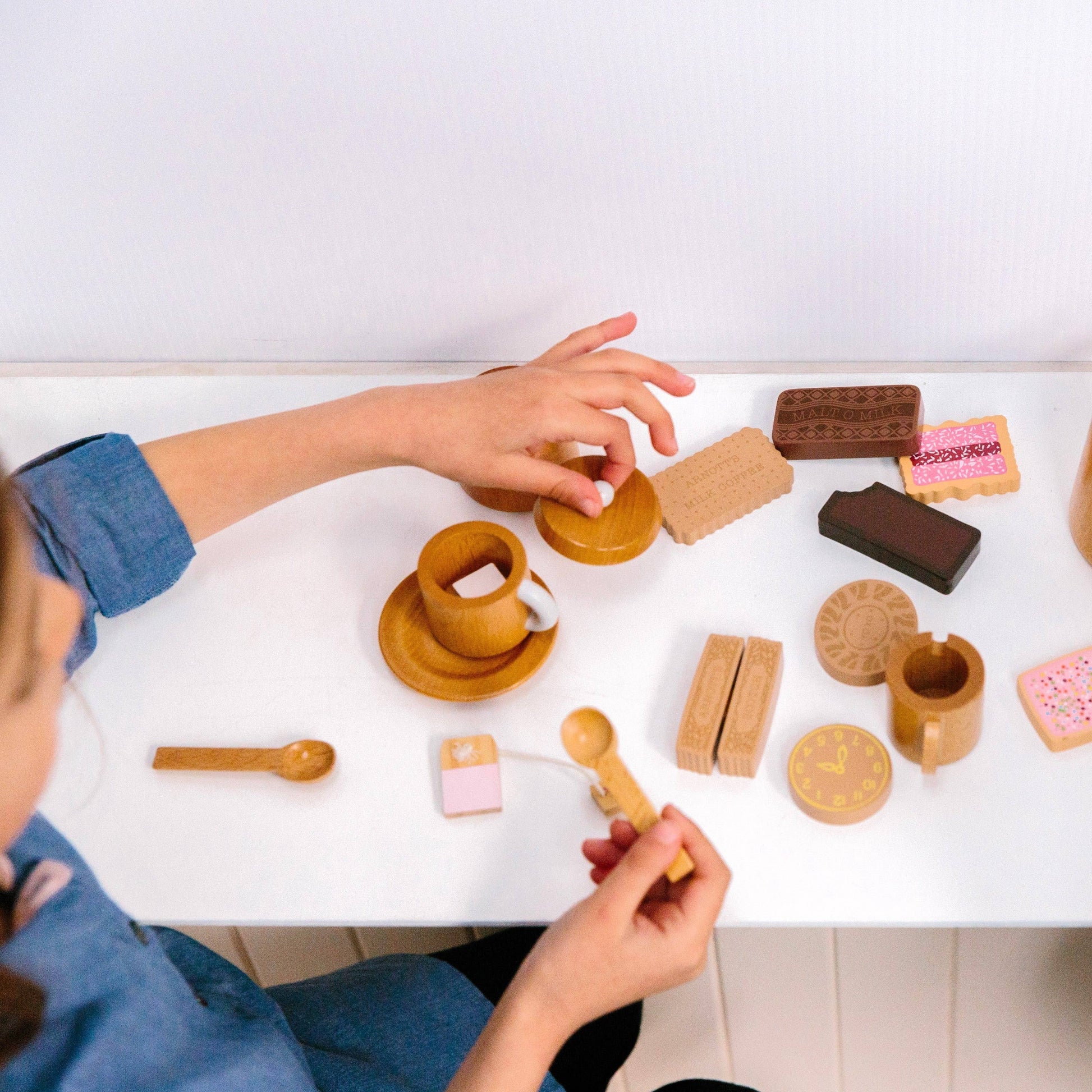 Make Me Iconic Wooden Tea Set top view of set with biscuits